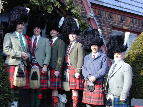 Five Cawthon Pipers and Perry in Kilts and Feather Bonnets