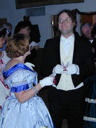 Gentleman and lady exchange ball cards to arrange for a dance