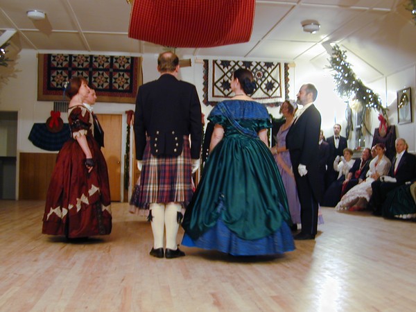 Victorian-style dancers in quadrille formation