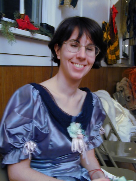 Lady named Kendra wearing a light blue Victorian-era dress